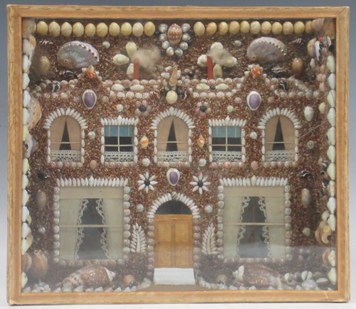 Lot 102 - A shell encrusted model house front in glazed...