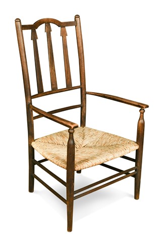 Lot 237 - An Arts & Crafts ash low elbow chair