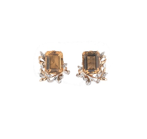 Lot 142 - A pair of citrine and diamond set ear studs