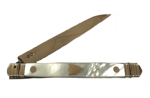 Lot 307 - A French metalwares gold and mother of pearl folding fruit knife