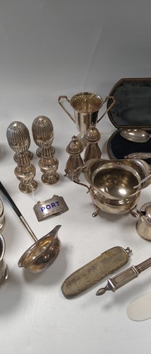 Lot 284 - A collection of silverware including tankards,...