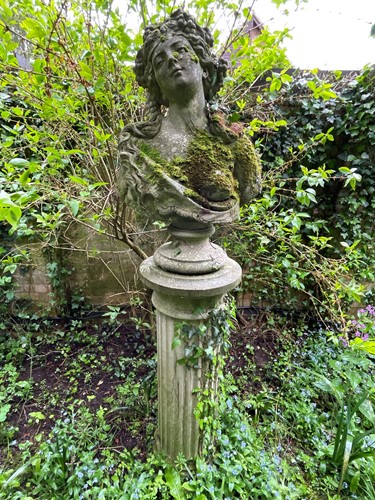 Lot 837 - A reconstituted stone female bust in Art Nouveau style on socle base, 20th century