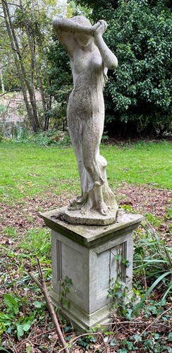 Lot 438 - A reconstituted stone classical style standing female figure, late 20th century
