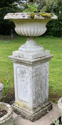 Lot 845 - A circular composition garden urn with lobed body, 20th century