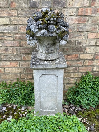 Lot 844 - A reconstituted stone basket of fruit garden ornament, late 20th century
