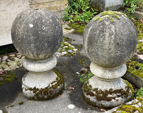Lot 817 - A pair of composition stone ball finials, late 20th century