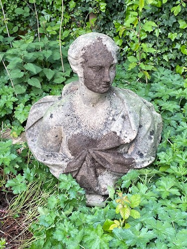 Lot 692 - A reconstituted stone classical style female bust on socle base, 20th century