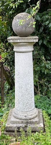 Lot 831 - A composition stone column with ball finial, late 20th century