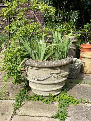 Lot 440 - A composition garden plant pot, late 20th century
