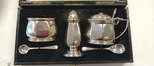 Lot 285 - A collection of silverware including cruets,...