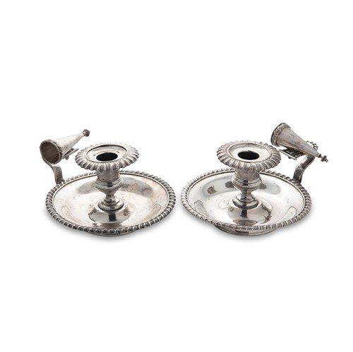 Lot 333 - A pair of 19th century French metalwares silver chambersticks