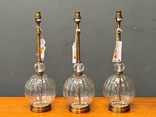 Lot 631 - Three Pooky glass and brass lamps with ribbed...