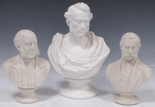 Lot 24 - Two Parian busts of gentlemen, on socle bases,...