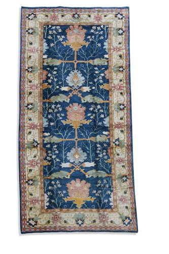 Lot 261 - Liberty & Co., an Arts & Crafts style carpet, modern