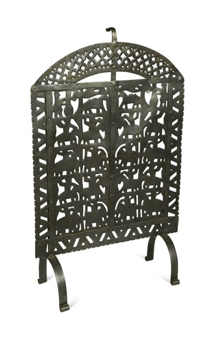 Lot 254 - An Arts & Crafts style wrought iron fire screen