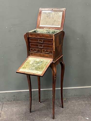 Lot 559 - A French cabinet, the hinged top with a mirror,...