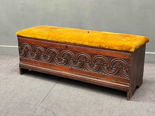 Lot 576 - A Continental carved oak ottoman incorporating...