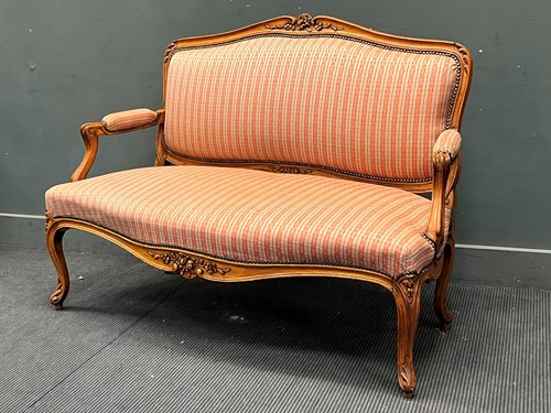 Lot 620 - A Louis XV style beech framed settee, the...