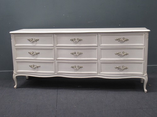 Lot 584 - A French style white painted bank of drawers...