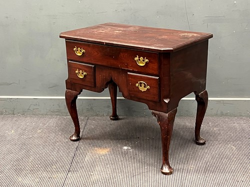 Lot 372 - A George III and later mahogany lowboy, with...