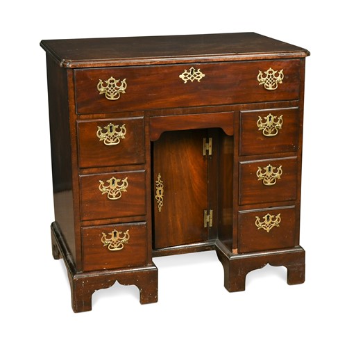 Lot 510 - A George III mahogany kneehole desk