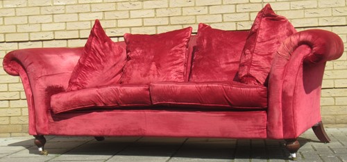 Lot 471 - A Chesterfield style red velvet type sofa, on...