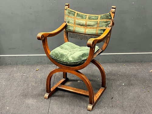 Lot 594 - An oak Savonarola style open armchair, circa...