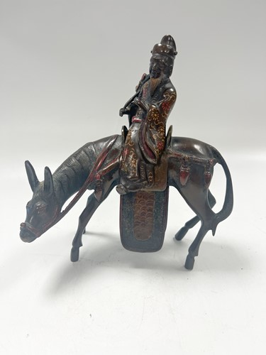 Lot 38 - A Chinese painted bronze figure or censer of a Confucian scholar on horseback, early 20th century