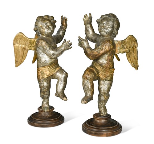 Lot 122 - A pair of silvered wood cherubs, 17th century