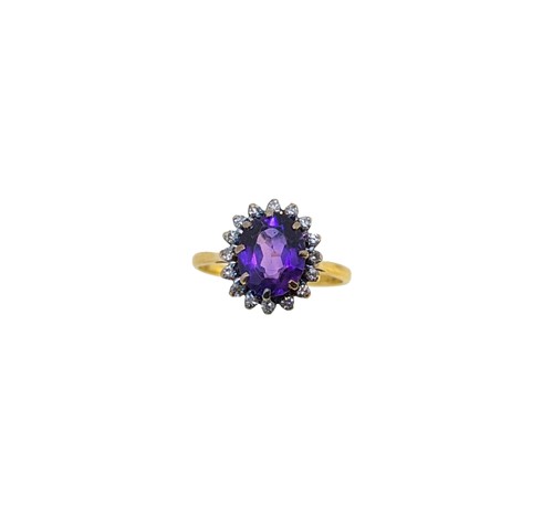 Lot 45 - An 18ct gold amethyst and diamond cluster ring