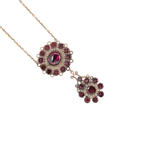 Lot 75 - A 19th century garnet and paste pendant with later chain