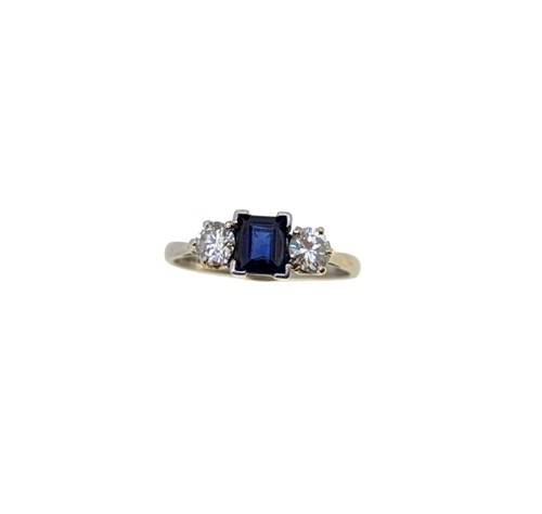 Lot 109 - An 18ct gold sapphire and diamond three stone ring