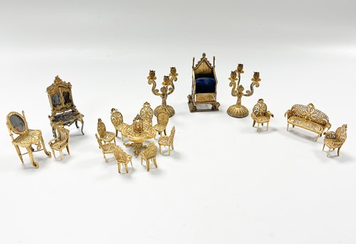 Lot 183 - A collection of gilt metal dolls' house furniture
