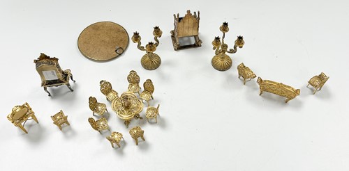Lot 183 - A collection of gilt metal dolls' house furniture