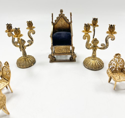 Lot 183 - A collection of gilt metal dolls' house furniture