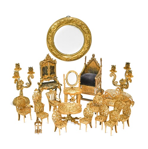 Lot 183 - A collection of gilt metal dolls' house furniture