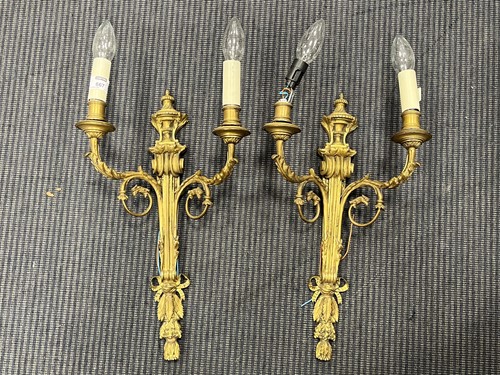 Lot 631 - A pair of gilt metal twin-branch wall-lights...