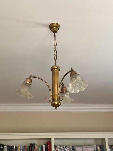 Lot 674 - A lacquered brass three branch 1920's style...