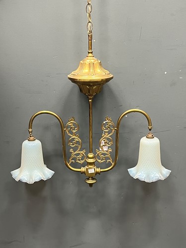 Lot 678 - A Victorian brass ceiling light, the twin swan...