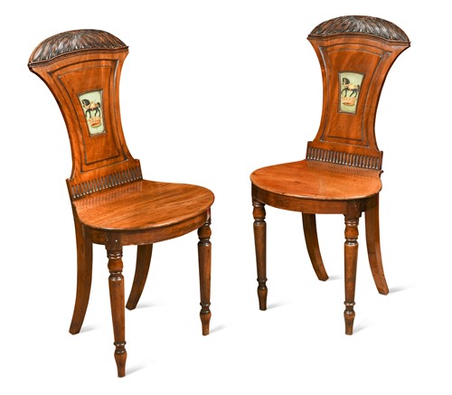 Lot 225 - A pair of Regency mahogany hall chairs, crica 1810