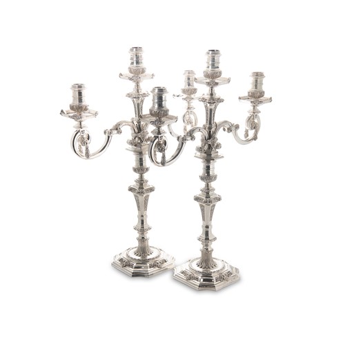 Lot 437 - A pair of Elizabeth II cast silver three light metamorphic candelabra, mark of Asprey & Company
