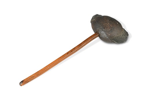 Lot 673 - A primitive stone axe head, likely of American origin