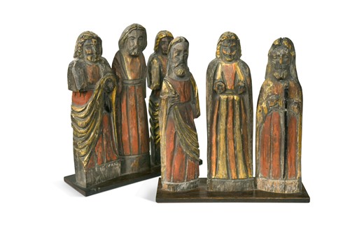 Lot 33 - A pair of 17th century style carved and polychrome decorated figure groups, 20th century