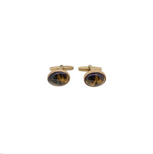 Lot 110 - A pair of tiger’s eye cufflinks