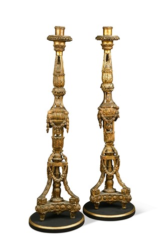 Lot 129 - A pair of neoclassical carved and giltwood torcheres, Continental, 19th century