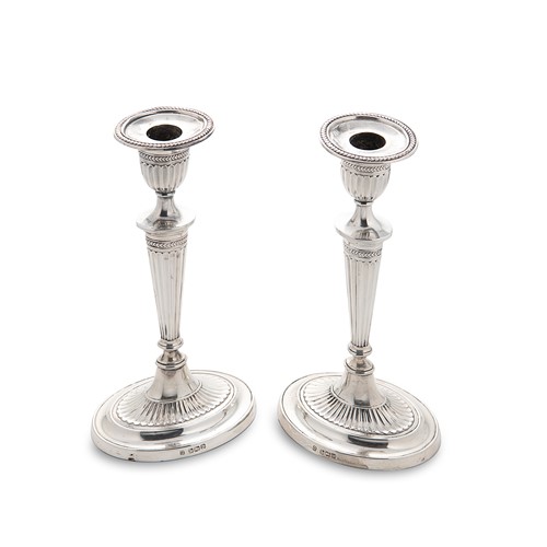 Lot 404 - A pair of Edward VII silver candlesticks