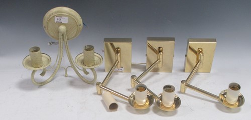 Lot 135 - A set of three single lamp wall lights,...