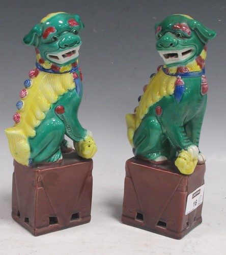 Lot 16 - A pair of Chinese pottery Foo dogs