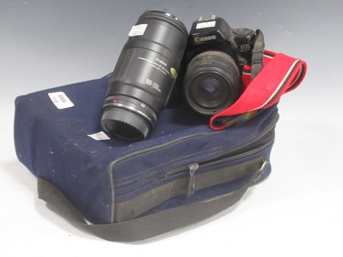 Lot 118 - A Canon EOS 1000 SLR camera and lense,...