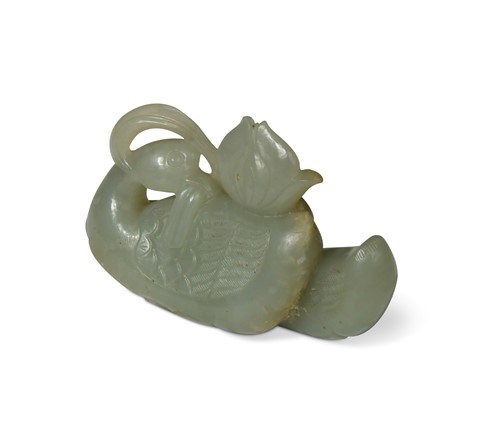 Lot 26 - A Chinese light green jade waterfowl ornament, Qing Dynasty 19th century